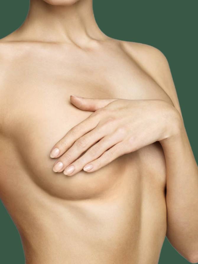 woman holding her breast woman holding her breast